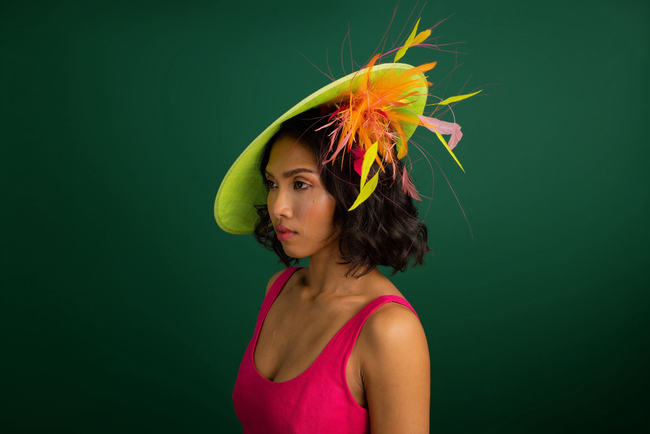 Free Spirit: neon green fascinator with colourful feathers