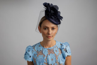 Navy fascinator with silk rose and birdcage veil