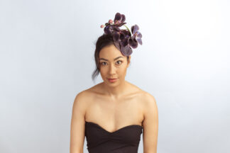 Simonetta Vespucci: Purple orchid fascinator