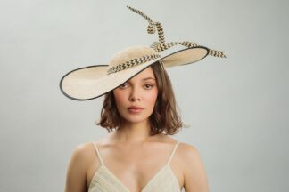 Black and cream dramatic hat with graphic 'flyaway' detail